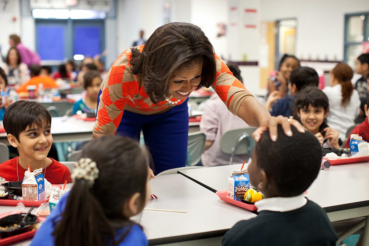 Former first lady Michelle Obama with students in Virginia sampling healthy meals being introduced by the United States Department of Agriculture