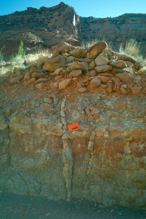 A dike to the left of the Red Notebook in the Chinle formation in Canyonlands National Park
